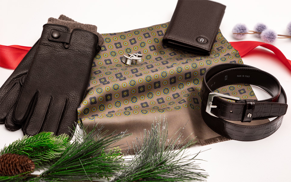 Edles Männer-Geschenkset mit Ledergürtel, Handschuhen, Portemonnaie und gemustertem Tuch im eleganten Look.