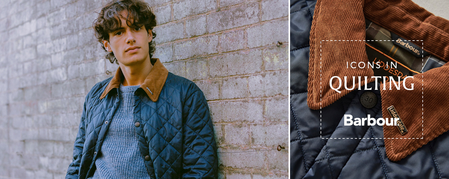 Ein junger Mann trägt eine gesteppte Barbour Liddesdale Jacke mit braunem Cord Kragen über einem blauen Pullover.
