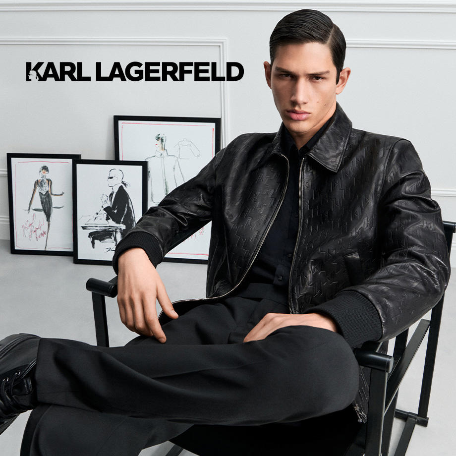 Mann in schwarzer Lederjacke mit Zopfmuster, lässig sitzend