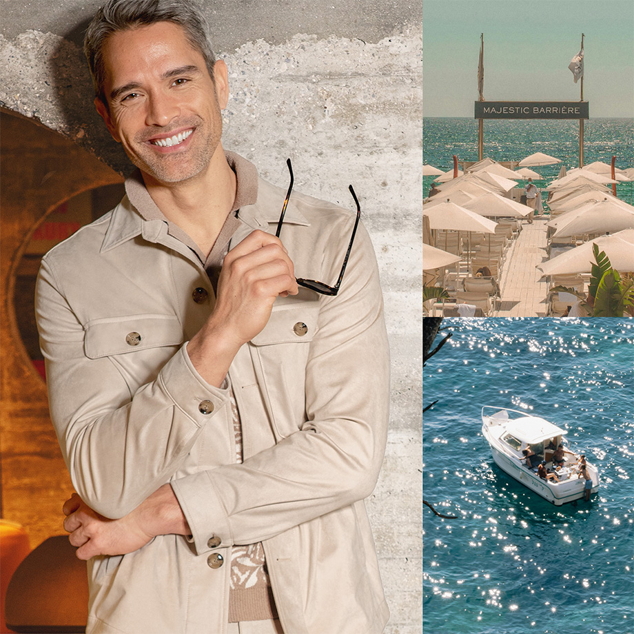 Sommerlicher Lifestyle-Mix: Lächelnder Mann mit hellbeigem Overshirt, Sonnenbrille, mediterrane Küstenstadt mit bunten Häusern und ein Boot auf türkisblauem Wasser – Urlaub, Stil und Entspannung in einem Bild vereint.