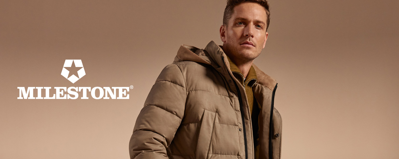 Model in warmer, beiger Steppjacke von MILESTONE – hochwertige Outdoor-Mode für Herren bei jedem Wetter auf Herrenausstatter.de.