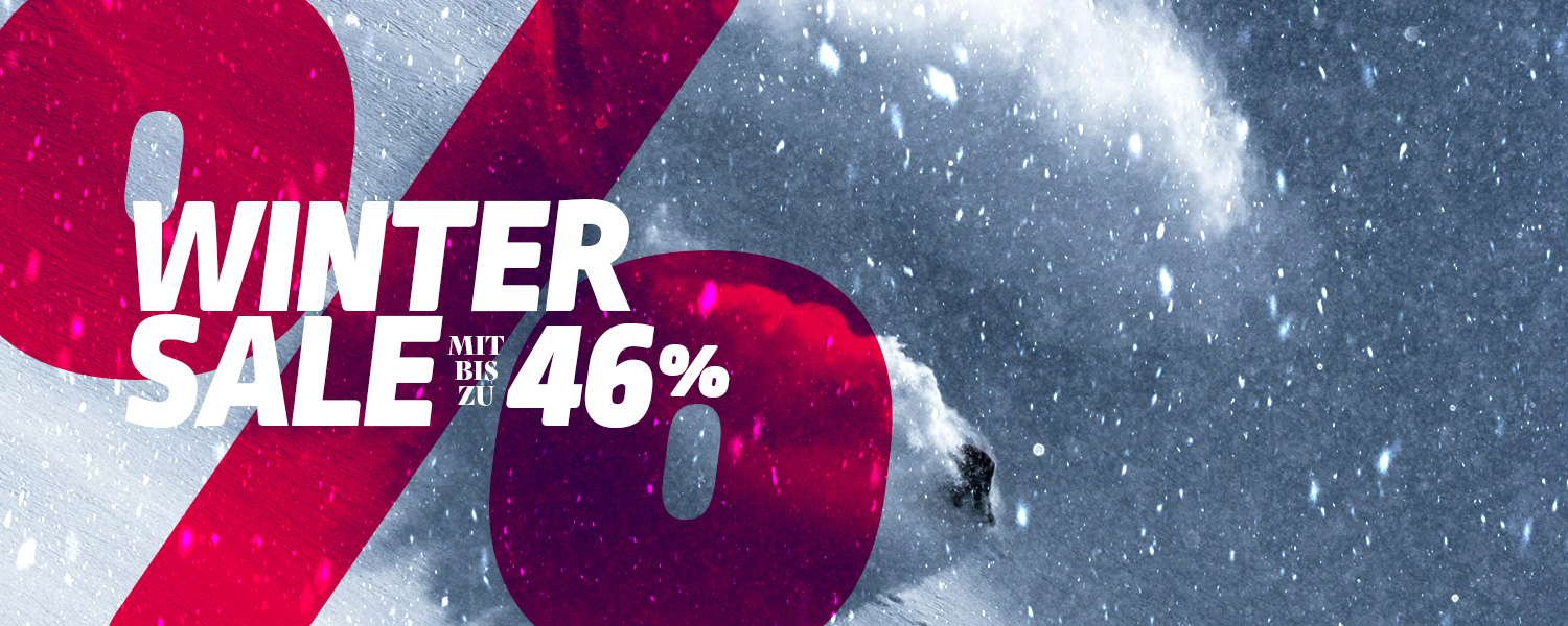 Winter-Schnee-Landschaft mit rotem Prozent-Symbol im Vordergrund