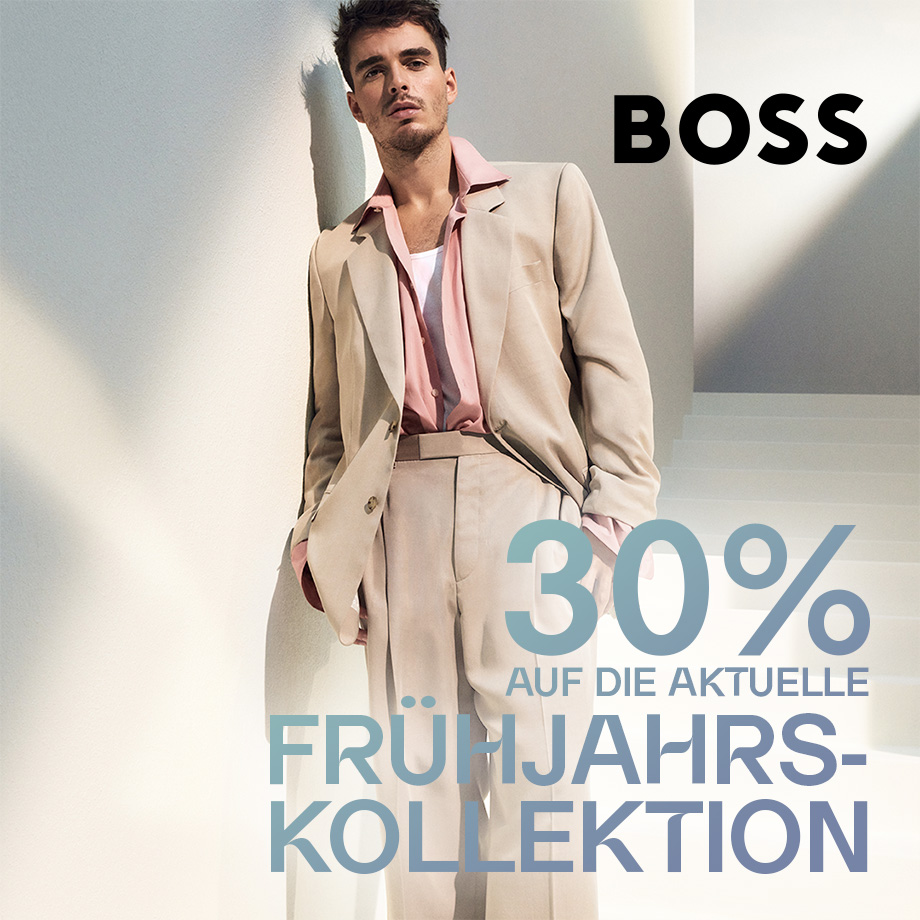 Hellbeige Anzug mit rosafarbenem Hemd, getragen von Mann in heller Umgebung